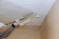 Interior room with a ceiling prepared for an updated finish