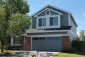 Two-story home with a refreshed gray exterior and contrasting white trim